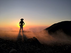 Pedro Perucho  stands on the steaming rim of Paricutin Volcano.